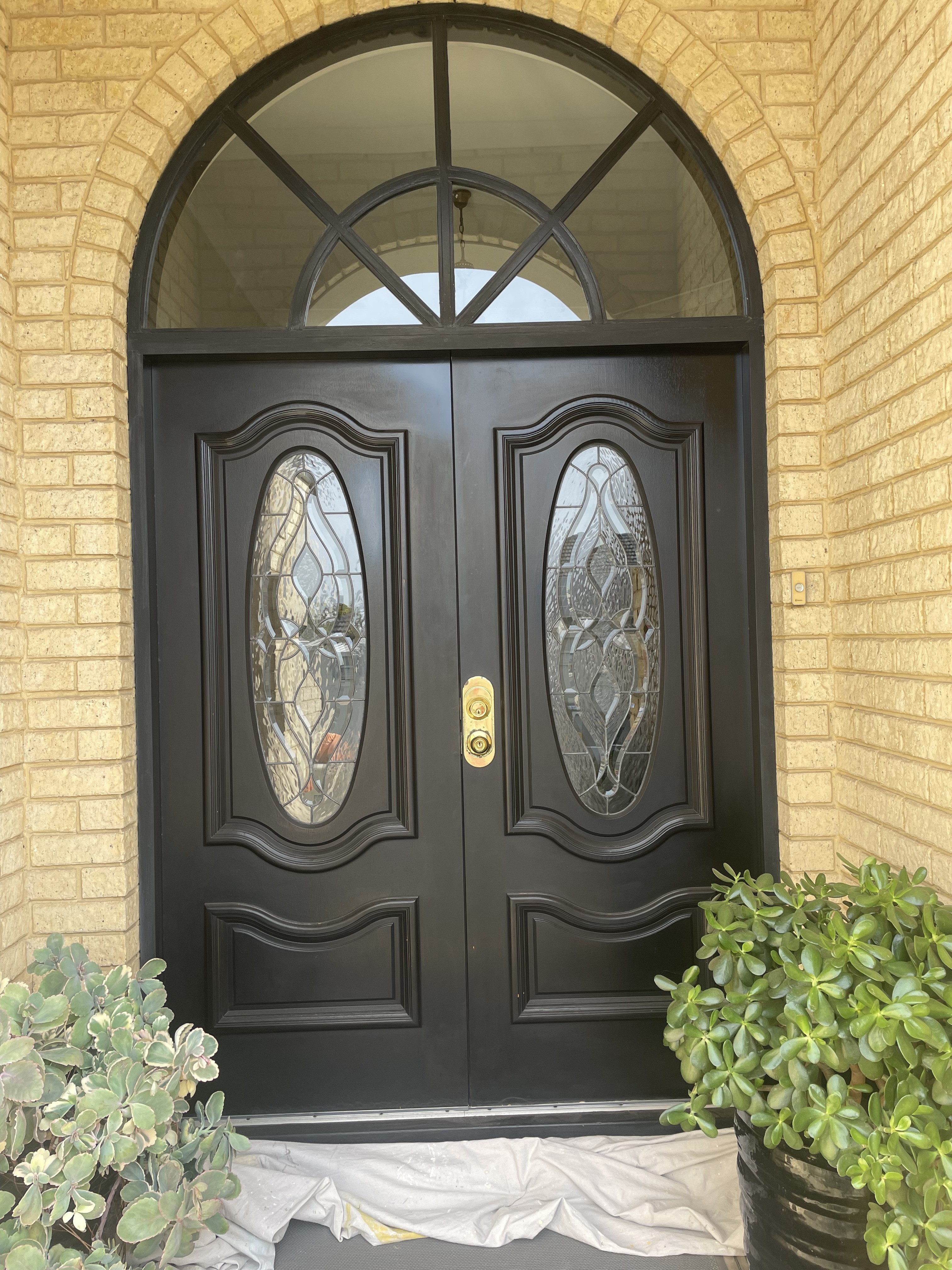 Black arched entry doors
